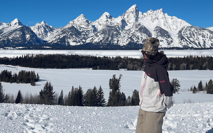 molly looking back at the snowy tetons