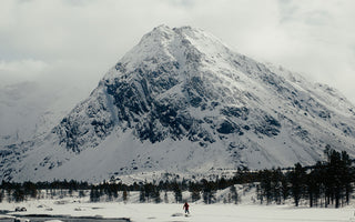 splitboarder in front of norwegian peak