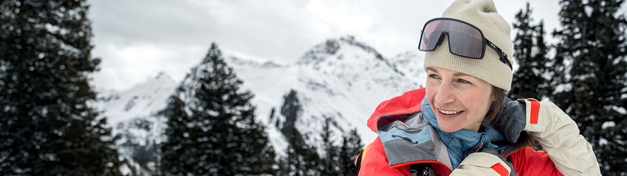 female skier smiling in strafe beanie