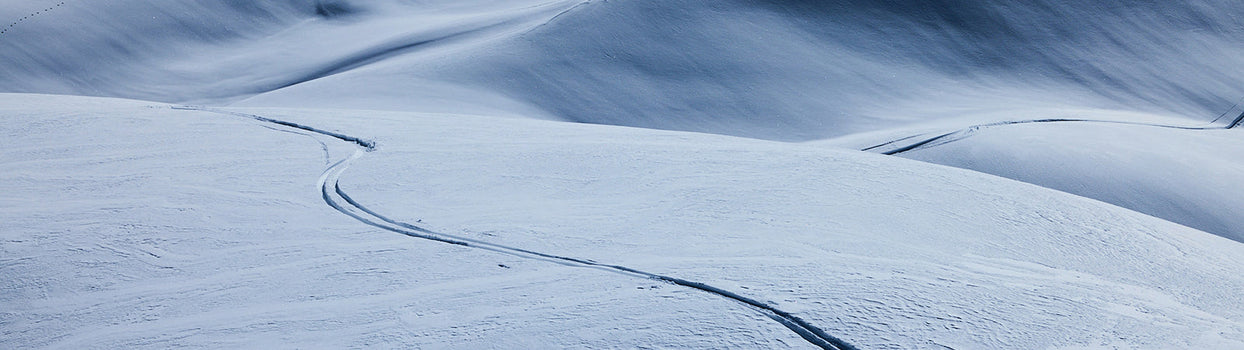 two friends talking on chairlift