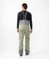on-model image of strafe outerwear fall/winter 23/24 collection mens nomad bib pant in moss