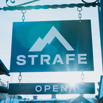 strafe showroom open sign