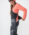 on-model image of strafe outerwear fall/winter 23/24 collection womens scarlett bib pant in blackout tie dye