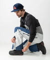 studio on-model image of strafe outerwear 2023 nomad 3l shell bib in frost grey color