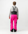 studio on-model image of strafe outerwear 2023 nomad 3l shell bib in fuchsia color
