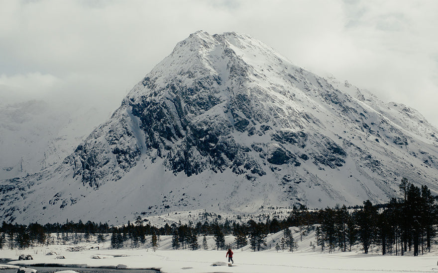 splitboarder in front of norwegian peak