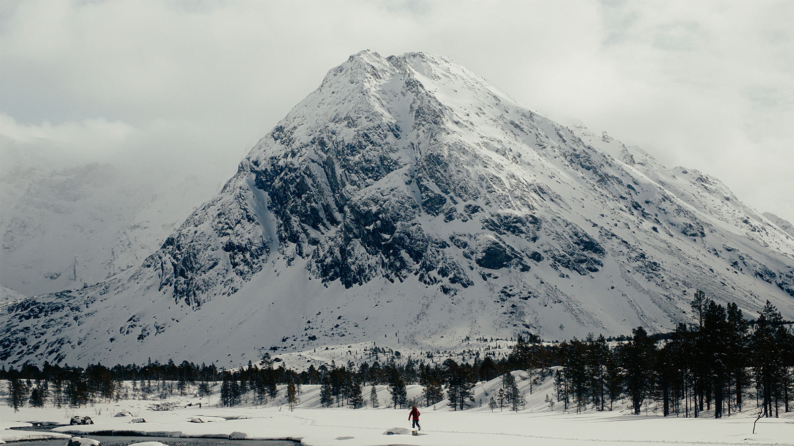 splitboarder in front of norwegian peak