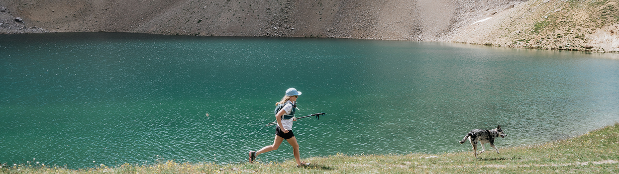 running by alpine lake