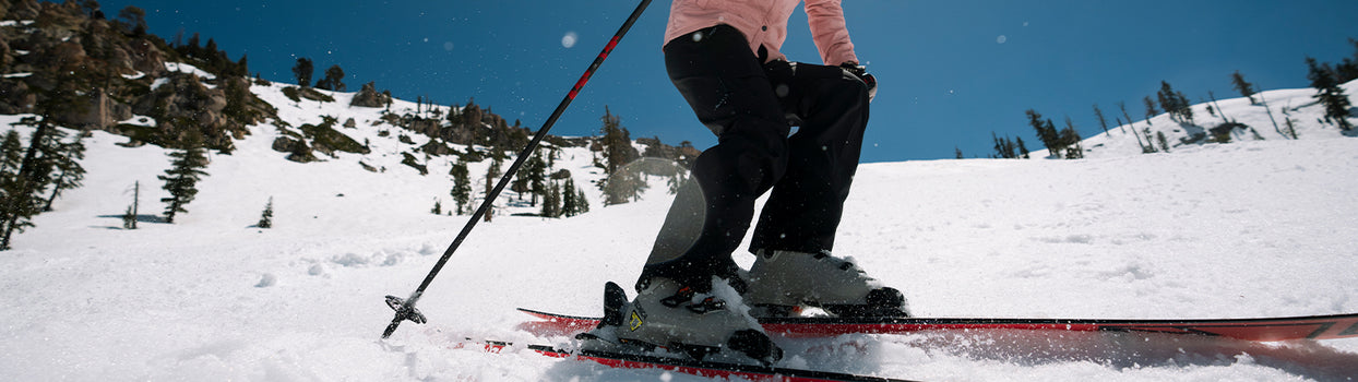 skier turn on groomer in willow pant