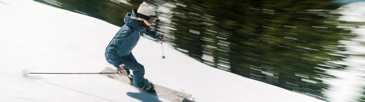 skiing fast in strafe one-piece, sickbird suit