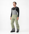 on-model image of strafe outerwear fall/winter 23/24 collection mens nomad bib pant in moss