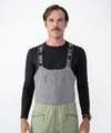 on-model image of strafe outerwear fall/winter 23/24 collection mens nomad bib pant in moss