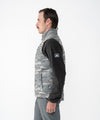 on-model image of strafe outerwear fall/winter 23/24 collection shadow mountain vest in distressed moss camo