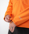 on-model image of strafe outerwear fall/winter 22/23 collection cham pullover in tangerine