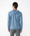 on-model image of strafe outerwear fall/winter 23/24 collection mens basecamp full zip baselayer in storm cloud blue