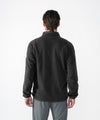 on-model image of strafe outerwear fall/winter 23/24 collection mens ajax snap fleece mid-layer in black