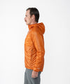 on-model image of strafe outerwear fall/winter 23/24 collection mens ultralight aero hooded insulator in amber