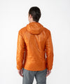 on-model image of strafe outerwear fall/winter 23/24 collection mens ultralight aero hooded insulator in amber