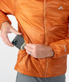 on-model image of strafe outerwear fall/winter 23/24 collection mens ultralight aero hooded insulator in amber