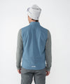 on-model image of strafe outerwear fall/winter 23/24 collection mens temerity vest in storm cloud blue