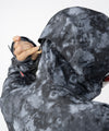 on-model image of strafe outerwear fall/winter 23/24 collection women&#39;s meadow jacket in blackout tie dye