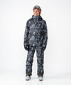 on-model image of strafe outerwear fall/winter 23/24 collection women&#39;s meadow jacket in blackout tie dye