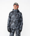 on-model image of strafe outerwear fall/winter 23/24 collection women&#39;s meadow jacket in blackout tie dye