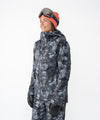 on-model image of strafe outerwear fall/winter 23/24 collection women&#39;s meadow jacket in blackout tie dye