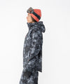 on-model image of strafe outerwear fall/winter 23/24 collection women&#39;s meadow jacket in blackout tie dye