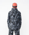 on-model image of strafe outerwear fall/winter 23/24 collection women&#39;s meadow jacket in blackout tie dye