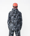 on-model image of strafe outerwear fall/winter 23/24 collection women&#39;s meadow jacket in blackout tie dye 