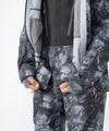 on-model image of strafe outerwear fall/winter 23/24 collection women&#39;s meadow jacket in blackout tie dye