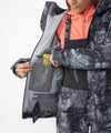 on-model image of strafe outerwear fall/winter 23/24 collection women&#39;s meadow jacket in blackout tie dye