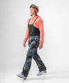 on-model image of strafe outerwear fall/winter 23/24 collection womens scarlett bib pant in blackout tie dye