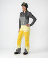 on-model image of strafe outerwear fall/winter 23/24 collection womens scarlett bib pant in lemon