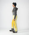 on-model image of strafe outerwear fall/winter 23/24 collection womens scarlett bib pant in lemon