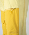 on-model image of strafe outerwear fall/winter 23/24 collection womens scarlett bib pant in lemon