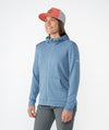 on-model image of strafe outerwear fall/winter 23/24 collection womens basecamp full zip baselayer in storm cloud blue