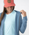 on-model image of strafe outerwear fall/winter 23/24 collection womens basecamp full zip baselayer in storm cloud blue