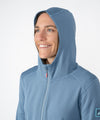 on-model image of strafe outerwear fall/winter 23/24 collection womens basecamp full zip baselayer in storm cloud blue