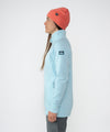 on-model image of strafe outerwear fall/winter 23/24 collection womens tech wrap collar mid-layer in arctic blue