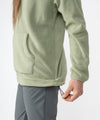 on-model image of strafe outerwear fall/winter 23/24 collection womens ajax snap fleece mid-layer in moss