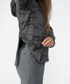 on-model image of strafe outerwear fall/winter 23/24 collection womens sunnyside pullover in distressed stealth camo