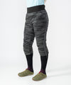 on-model image of strafe outerwear fall/winter 23/24 collection womens alpha insulator pant in distressed stealth camo