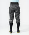 on-model image of strafe outerwear fall/winter 23/24 collection womens alpha insulator pant in distressed stealth camo