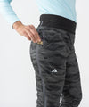 on-model image of strafe outerwear fall/winter 23/24 collection womens alpha insulator pant in distressed stealth camo