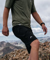 lifestyle image of strafe outerwear summer 2023 ms ridgeline short in black