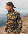 lifestyle image of strafe outerwear summer 2022 daly windshirt in dune camo