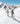 two women hiking carrying skis on shoulders