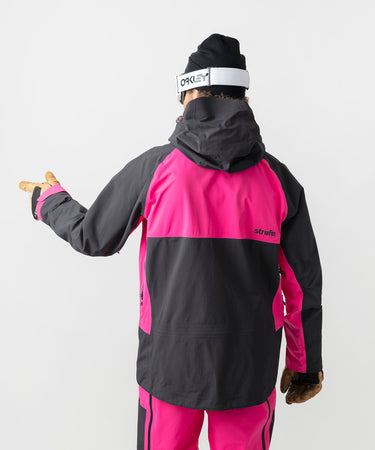 studio on-model image of strafe outerwear 2023 nomad 3l shell jacket in fuchsia color